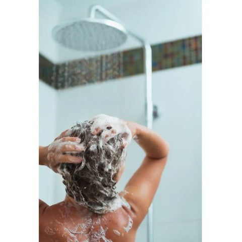 person with lathering natural shampoo